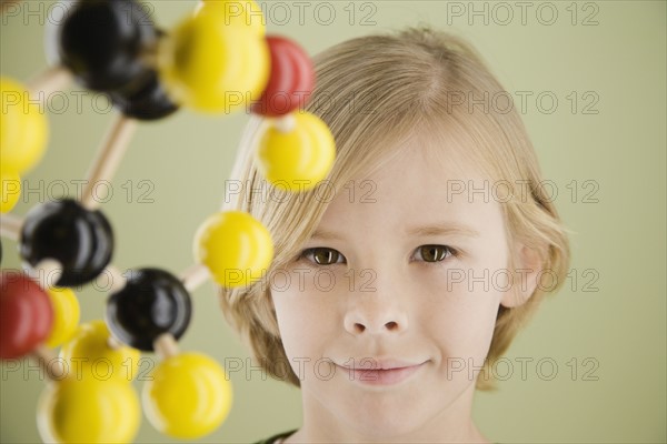 Boy next to molecular model. Date : 2008