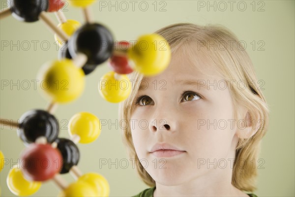 Boy looking at molecular model. Date : 2008