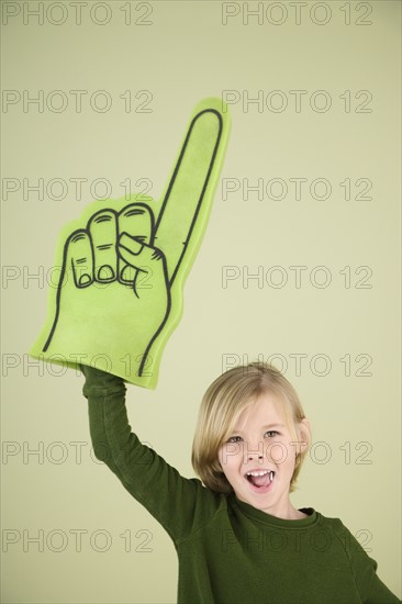 Boy holding foam Number One hand. Date : 2008