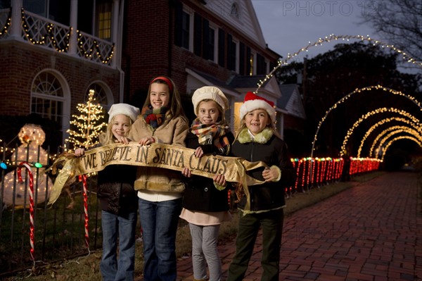 Girls holding Santa Claus banner. Date : 2008