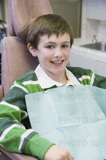 Boy sitting in dentist’s chair. Date : 2008