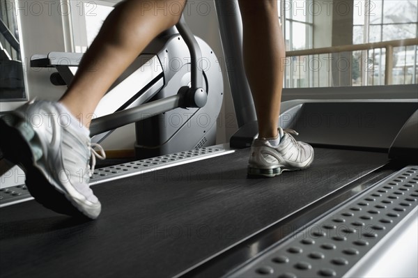 Woman walking on treadmill. Date : 2008