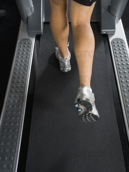 Woman running on treadmill. Date : 2008