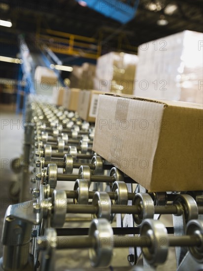 Packages on conveyor belt in warehouse. Date : 2008