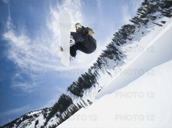 Man on snowboard in air. Date : 2008