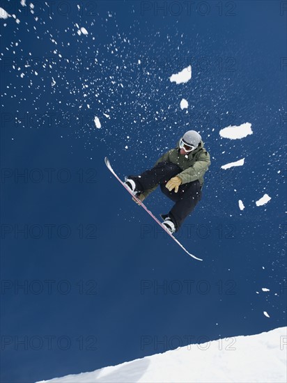 Man on snowboard in air. Date : 2008