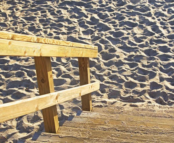 Wooden steps down to sand. Date : 2008