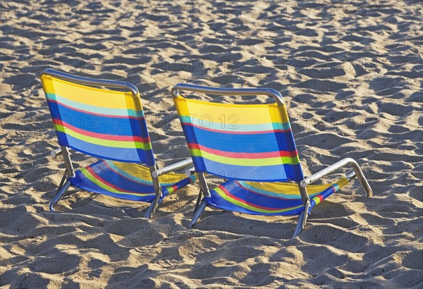 Empty beach chairs on sand. Date : 2008