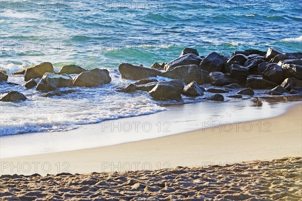 Rocks in water along beach. Date : 2008