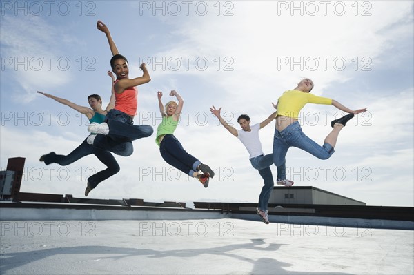 Multi-ethnic group performing modern dance. Date : 2008