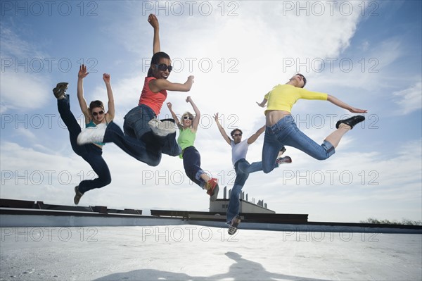 Multi-ethnic group performing modern dance. Date : 2008