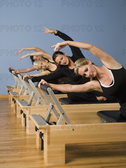 Women exercising in pilates class. Date : 2008