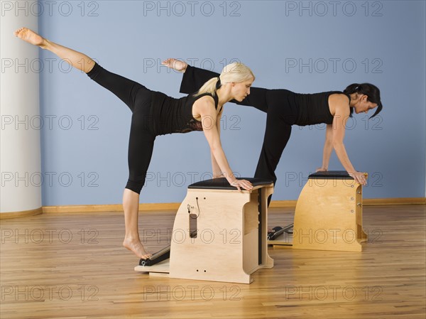 Women exercising in pilates class. Date : 2008