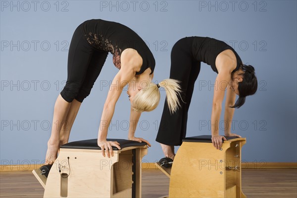 Women exercising in pilates class. Date : 2008