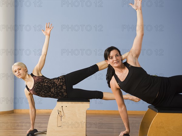 Women exercising in pilates class. Date : 2008