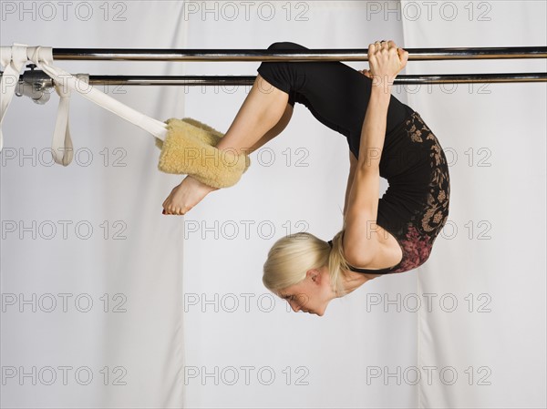 Woman exercising on pilates equipment. Date : 2008