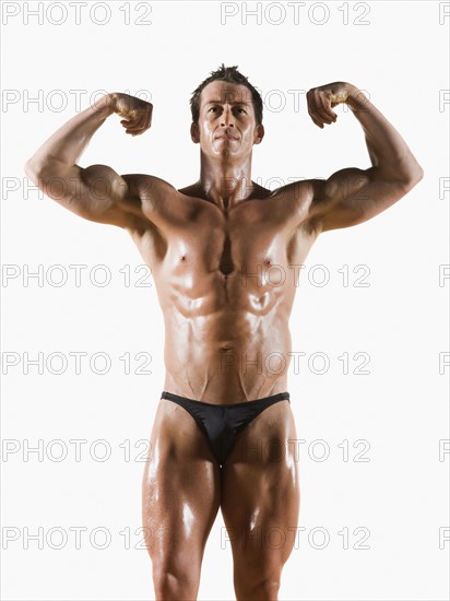 Male body builder flexing and posing. Date : 2008