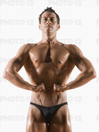 Male body builder flexing and posing. Date : 2008