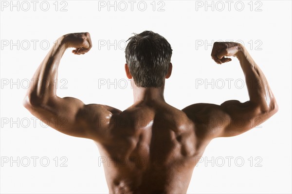 Male body builder flexing and posing. Date : 2008