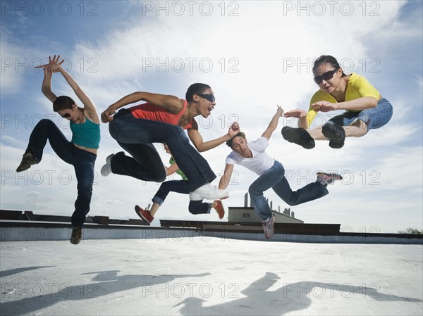 Multi-ethnic group performing modern dance. Date : 2008