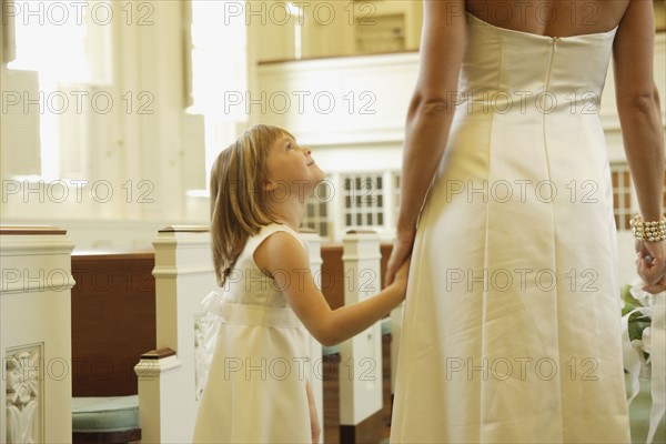 Bride holding flower girl’s hand. Date : 2008