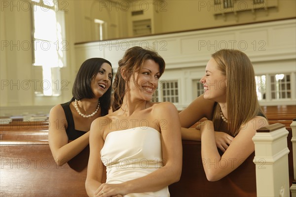 Bride laughing with friends. Date : 2008