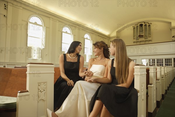 Bride laughing with friends. Date : 2008