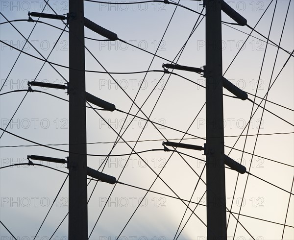 Low angle view of power lines on poles. Date : 2008