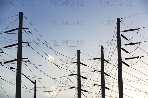 Low angle view of power lines on poles. Date : 2008