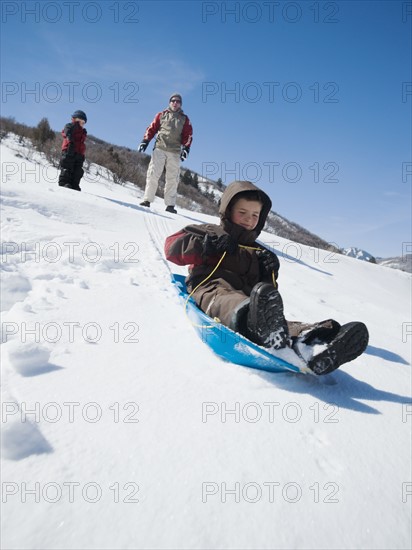 Boy riding on sled. Date : 2008