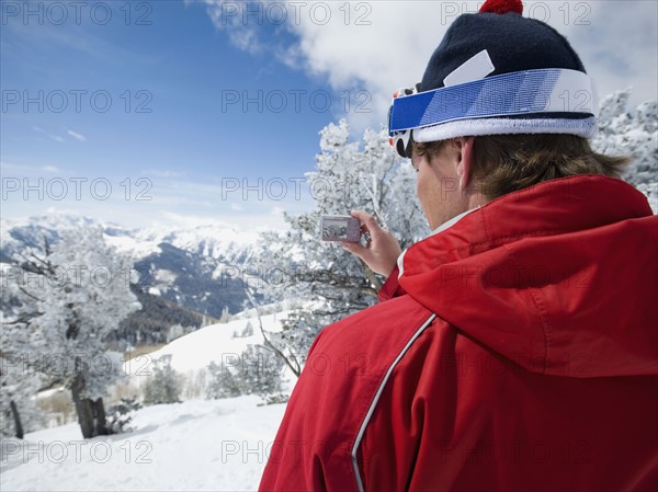 Man taking photograph, Wasatch Mountains, Utah, United States. Date : 2008