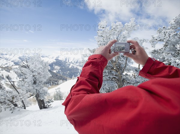 Man taking photograph, Wasatch Mountains, Utah, United States. Date : 2008