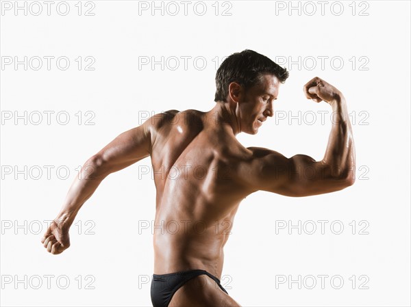 Male body builder flexing and posing. Date : 2008