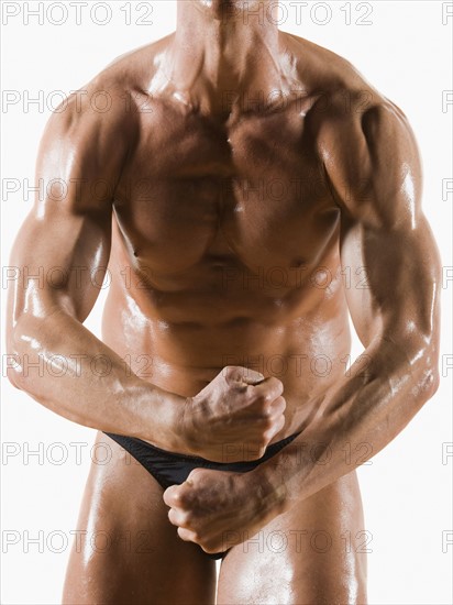 Male body builder flexing and posing. Date : 2008