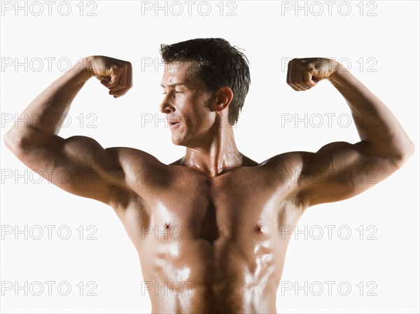 Male body builder flexing and posing. Date : 2008