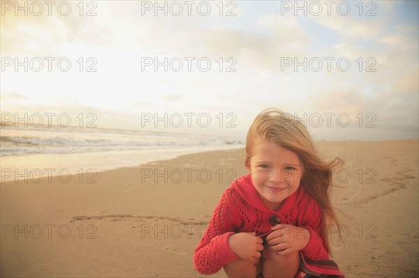 Girl sitting on beach. Date : 2008