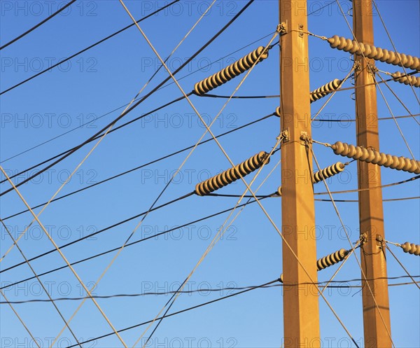 Low angle view of power lines on poles. Date : 2008