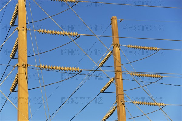 Low angle view of power lines on poles. Date : 2008