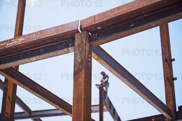 Construction worker on steel beam at construction site. Date : 2008