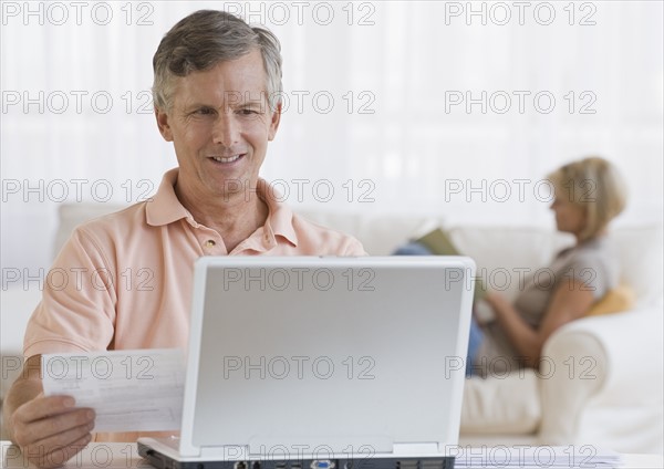 Man paying bills online.