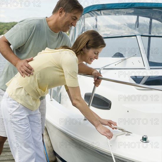 Couple docking speed boat.