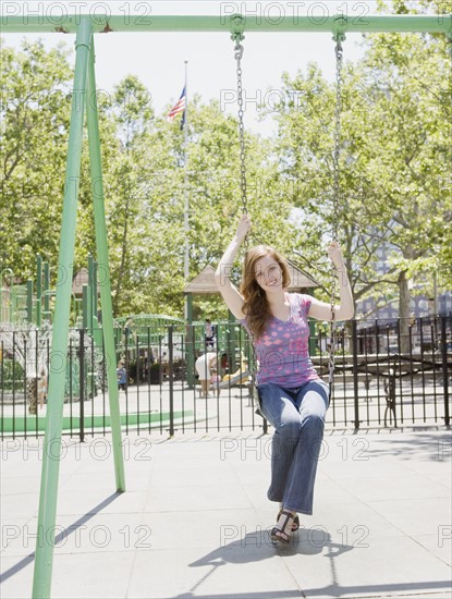 Woman swinging in park. Date : 2008