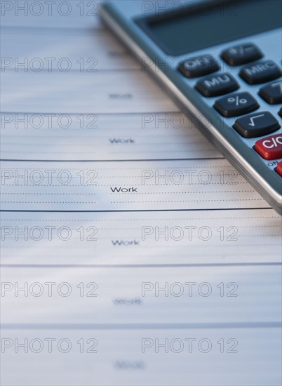 Close up of datebook and calculator. Date : 2008