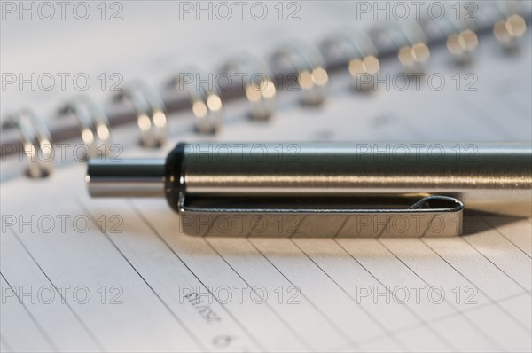 Close up of pen and organizer. Date : 2008