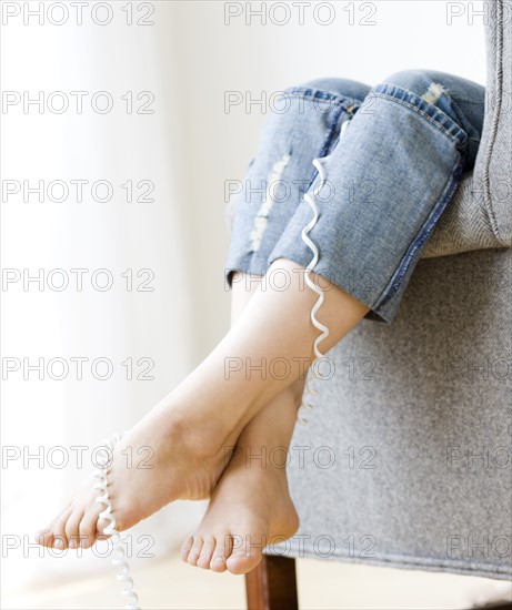 Teenage girl talking on telephone. Date : 2008