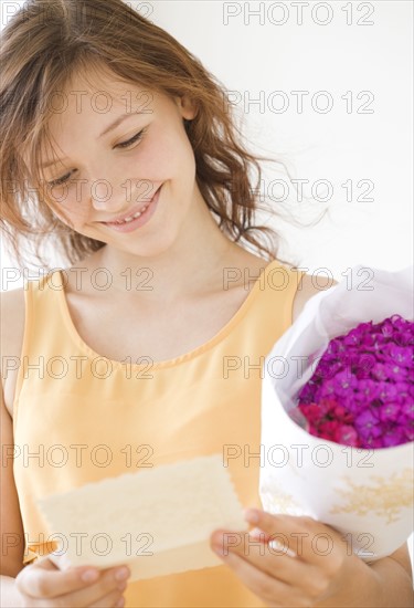 Teenage girl reading gift card. Date : 2008