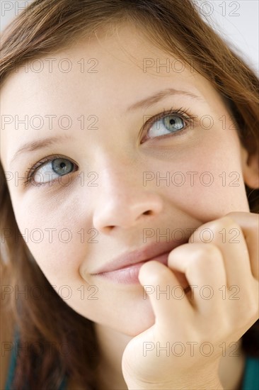 Close up of teenage girl daydreaming. Date : 2008