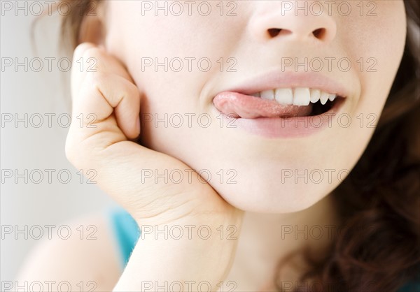 Teenage girl licking lips. Date : 2008