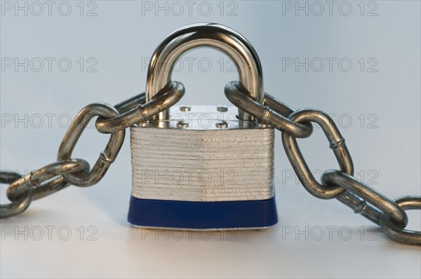 Close up of lock and metal chain. Date : 2008