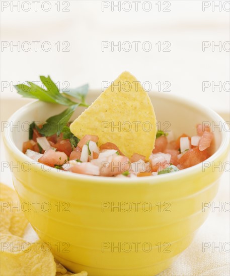 Close up of salsa and tortilla chips. Date : 2008